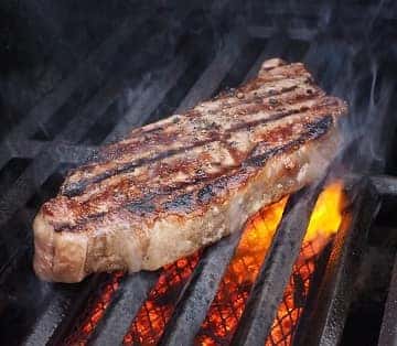 a steak on a barbecue grill