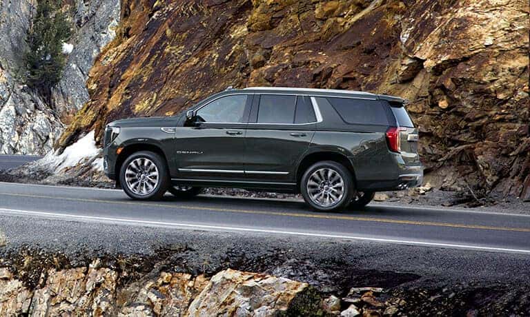 2021 GMC Yukon Exterior Driving On A Rocky Mountain Road