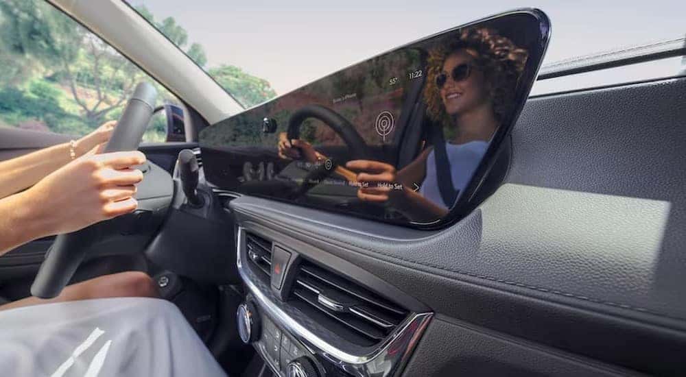 The gray dash and infotainment display is shown in a 2024 Buick Encore GX.