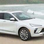 A white 2024 Buick Envista Avenir parked overlooking the ocean.