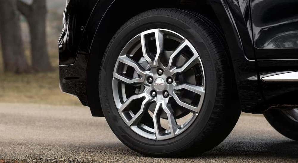 A close-up on a wheel on a 2024 GMC Terrain Denali is shown.