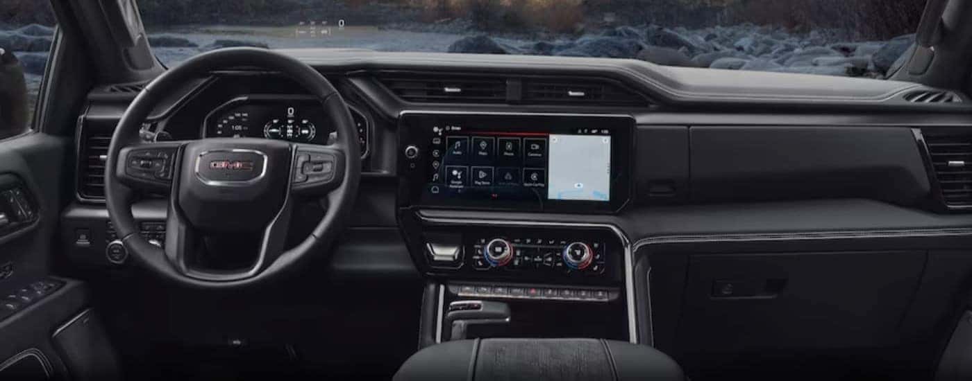 The black interior and dash in a 2024 GMC Sierra 1500 is shown.