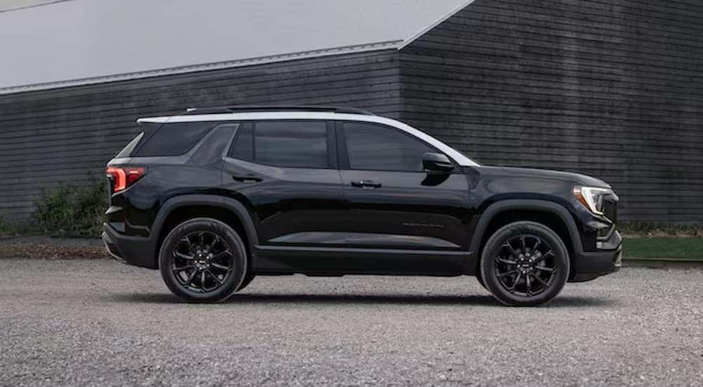 A black 2025 GMC Terrain is shown parked after visiting a Buick GMC dealer near Naperville.