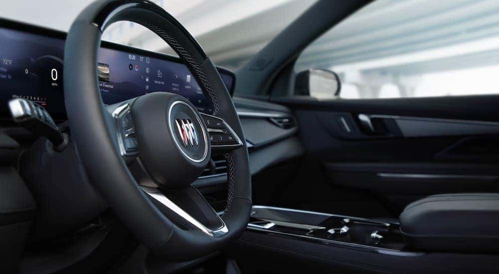 A close up of the steering wheel in a 2025 Buick Enclave.