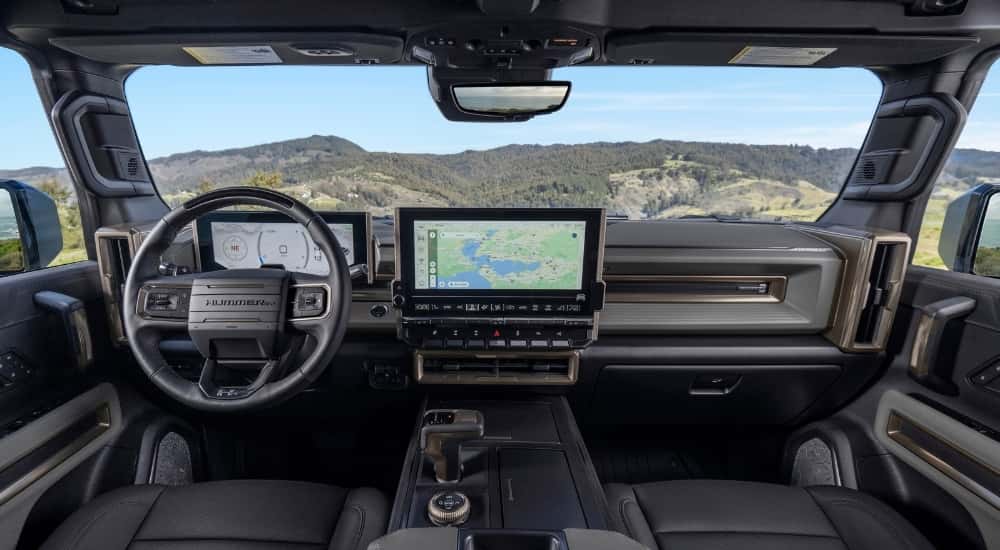 The black interior of a 2025 GMC Hummer EV is shown.