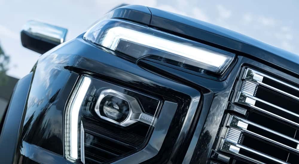 Passenger side headlight on a black 2025 GMC Canyon Denali.