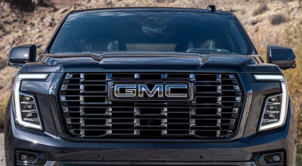 Close-up of the grille on a black 2025 GMC Yukon.