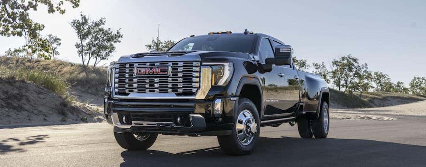 A black 2025 GMC Sierra 3500 HD Denali from the front.