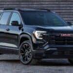 A black 2026 GMC Terrain at a dealer near Lombard