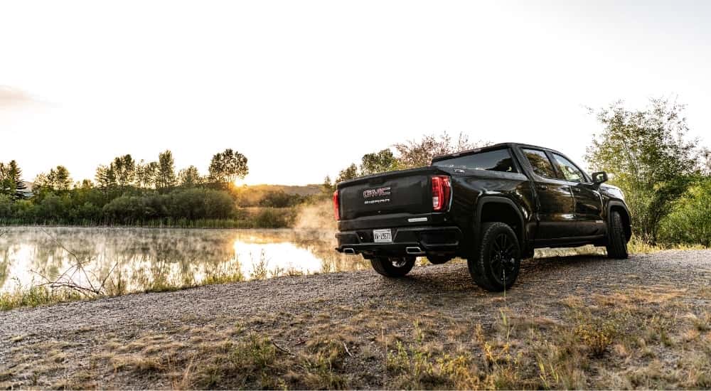 A black 2025 GMC Sierra 1500 for sale from the rear at an angle.
