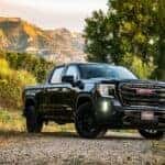 A black 2025 GMC Sierra 1500 from the front at an angle.