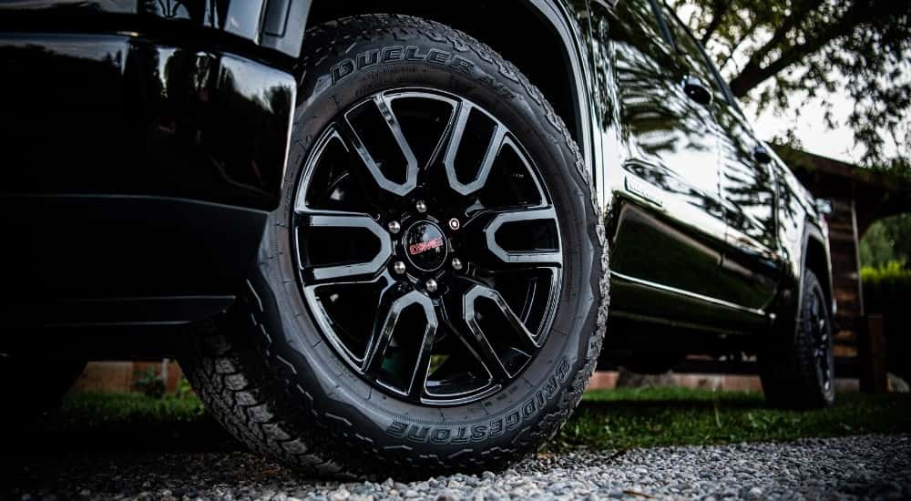 The wheel of a 2025 GMC Sierra 1500 in close-up.