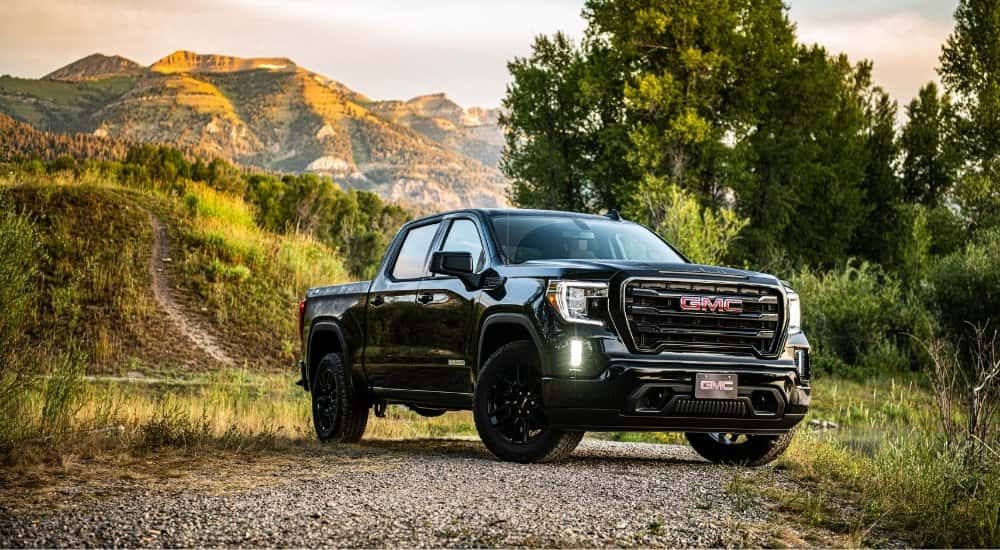 A black 2025 GMC Sierra 1500 from the front at an angle.