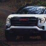 A white 2026 GMC Terrain AT4 parked off-road on a trail