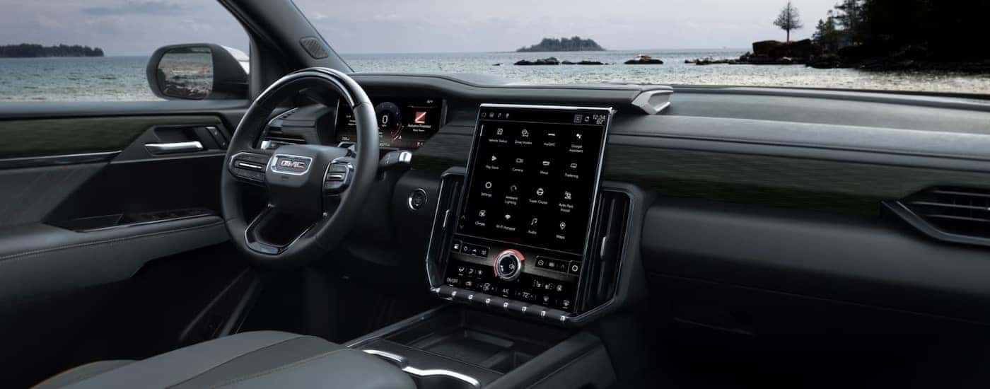 The black interior of a 2025 GMC Acadia.