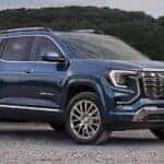 A blue 2026 GMC Terrain parked off-road.