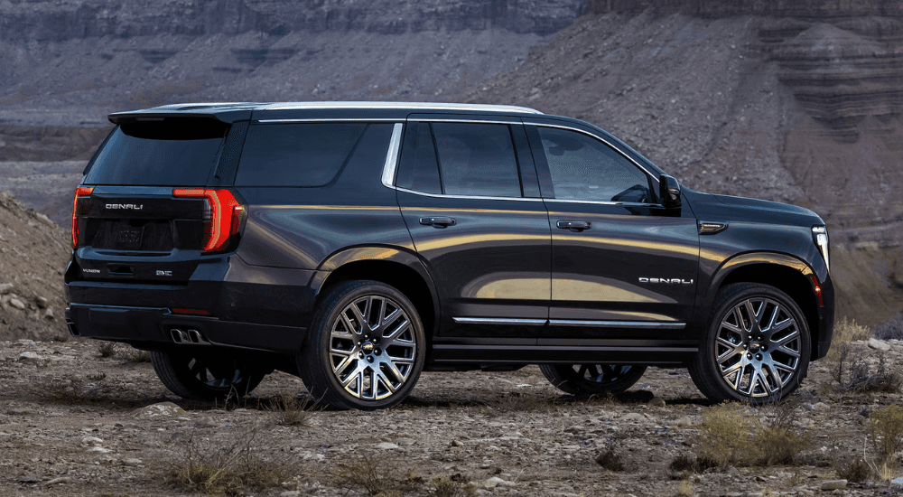 Side profile of a black 2026 GMC Yukon XL