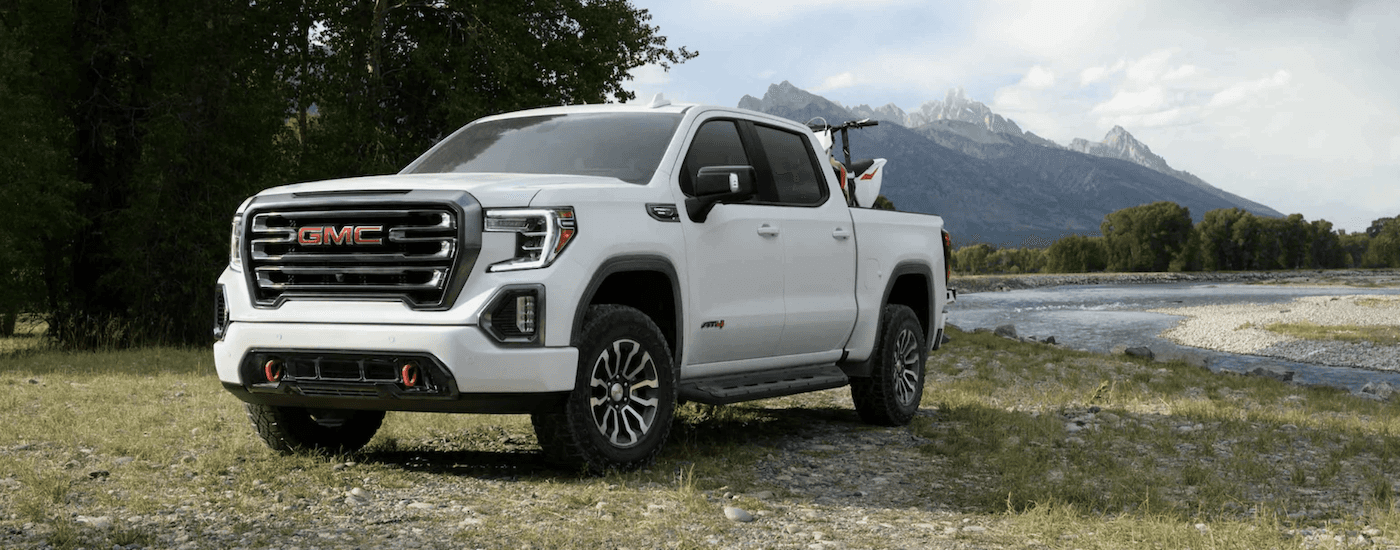 White 2021 GMC Sierra 1500 AT4 parked by water