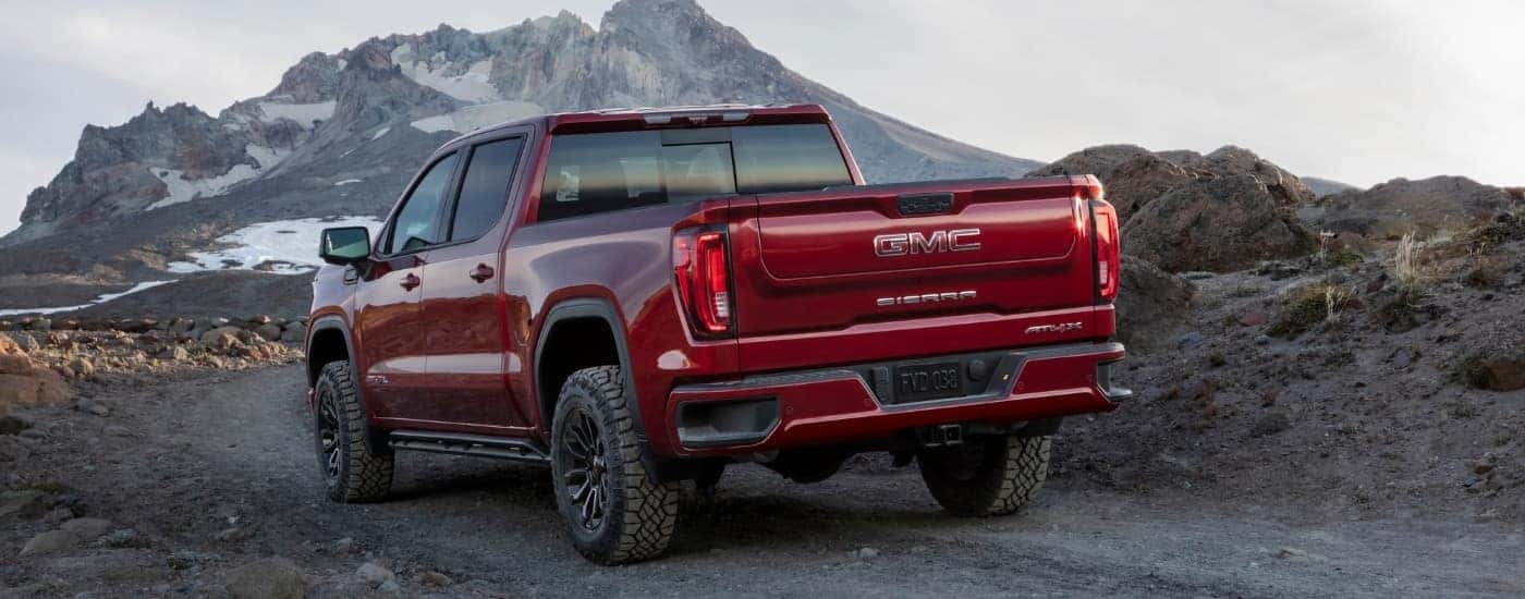 A red 2026 GMC Sierra 1500 from the rear.
