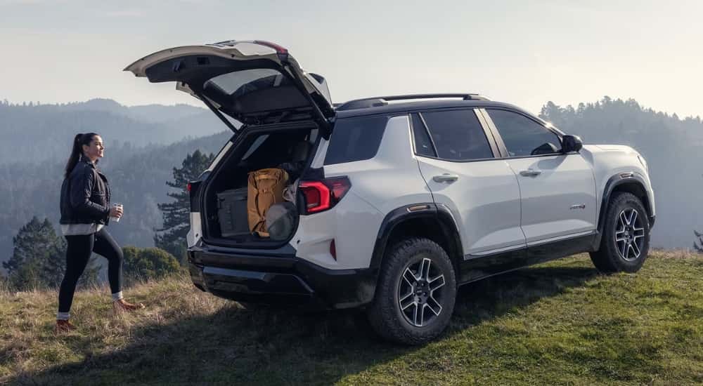 White 2026 GMC Terrain with the trunk open filled with gear