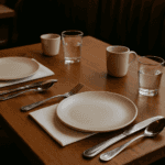 dining table with plates and silverware