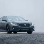Gray Honda sedan parked on road during day