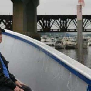 veteran looking over edge of pier