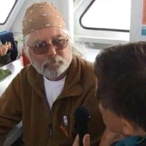 veteran with bandana getting interviewed