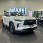 New 2023 INFINITI QX60 driving through snow in mountains