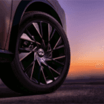 Tire on INFINITI QX65 with sunset in background