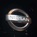 Metallic Nissan logo displayed in a dealership.