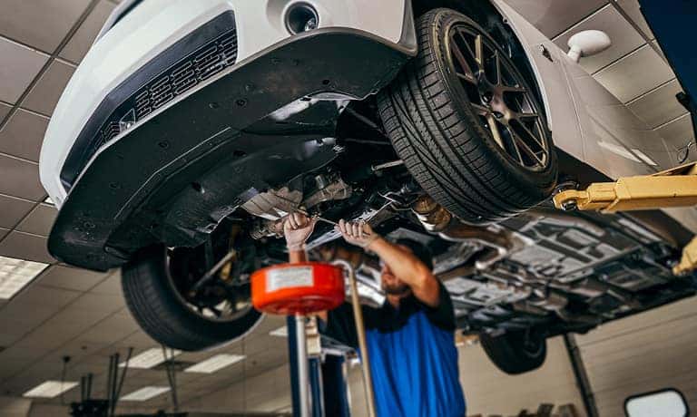 Service Tech Changing The Oil