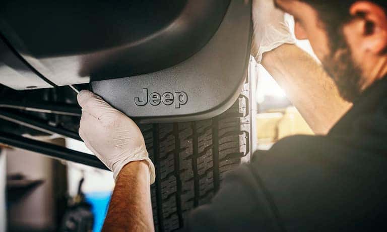Service Tech Adding Wheel Guards
