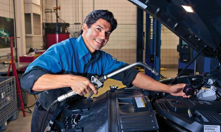 Service Tech Working on Engine