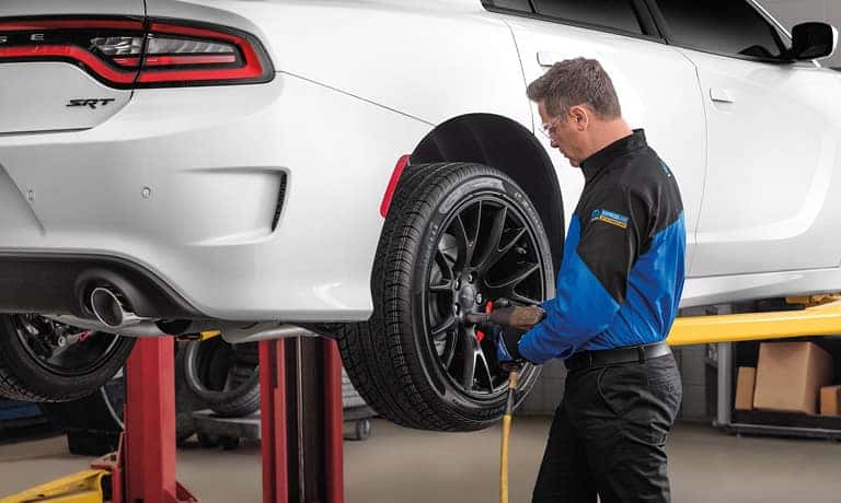 Service Tech Working On Wheel