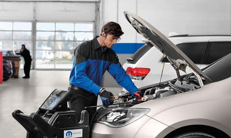 Service Tech Checking Battery