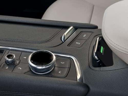 2024 Cadillac XT5 view of center console showing knobs and usb port
