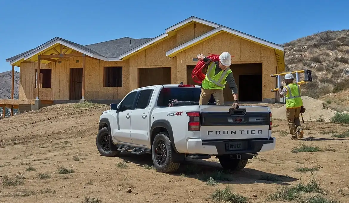 2026 Nissan Frontier workers at job site -- value and utility