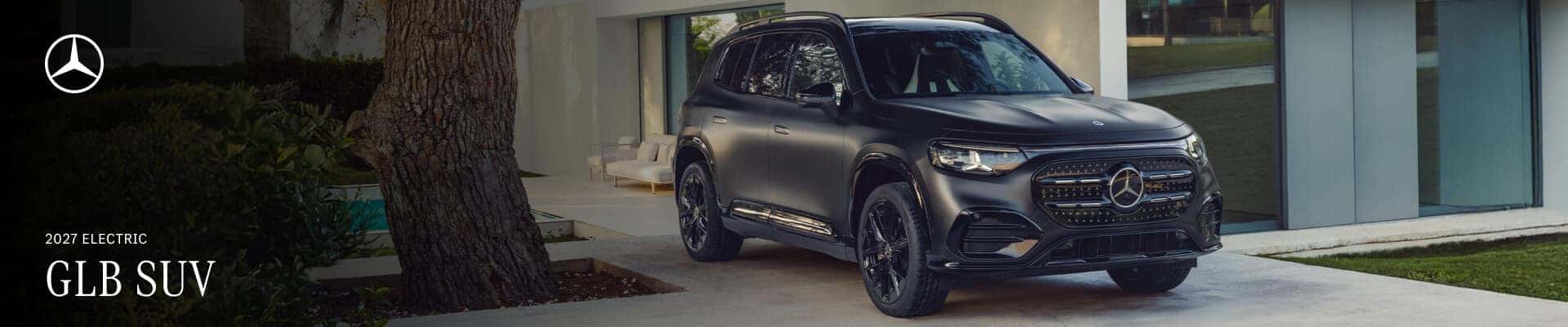 Exterior view of a black 2027 Mercedes-Benz Electric GLB SUV parked in an upscale driveway.