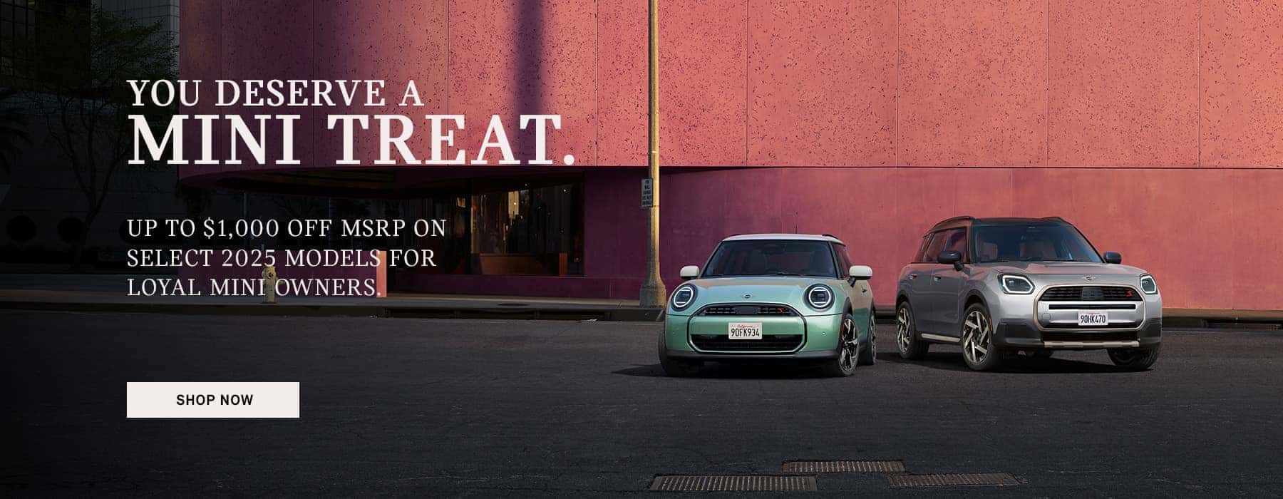 Two MINI's parked in front of a building.