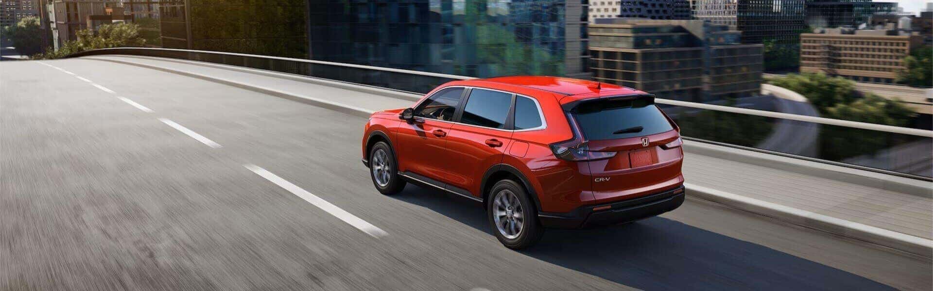 Quality Pre-Owned 2024 Honda CR-V Driving On A Street