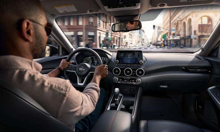 2022 Nissan Sentra with a driver behind the wheel