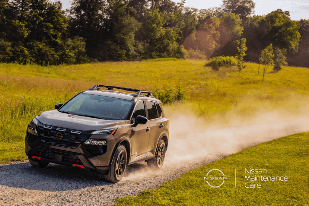 Nissan Rogue Driving on a Dirt Road Front 3/4 View