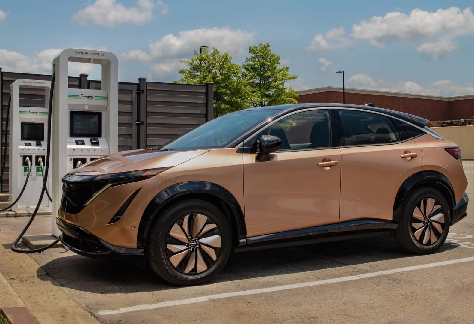 The 2024 Nissan Ariya, Parked At A Charging Station, Charging Swiftly