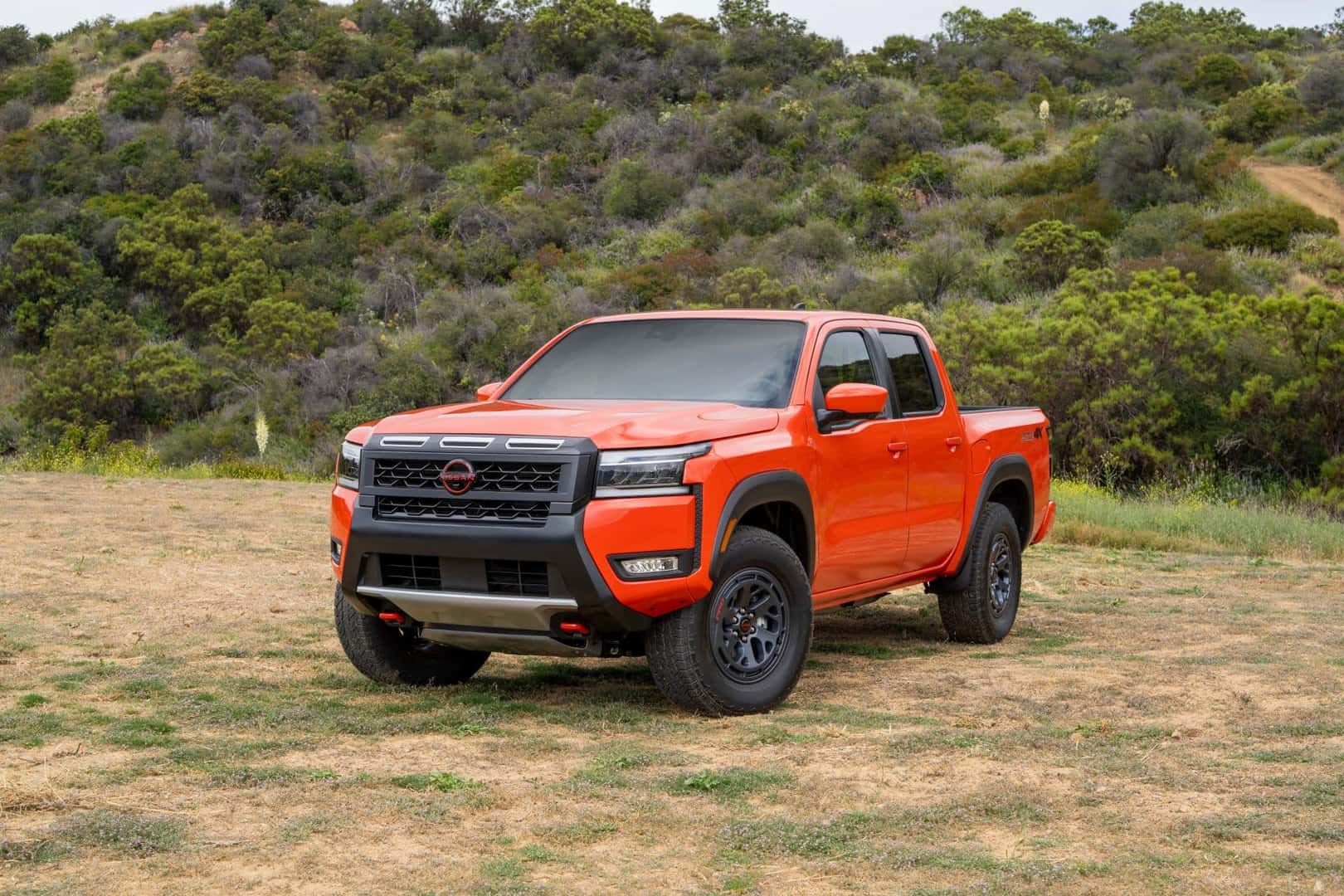 The Perfect Truck, The 2025 Nissan Frontier, Parked Near A Hill