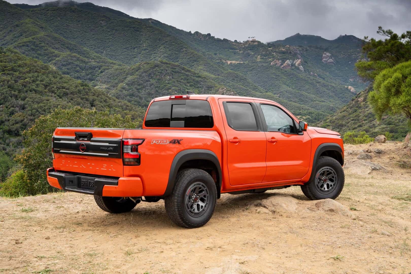 The Rear Exterior Of The Amazing 2025 Nissan Frontier, Near The Cliff Edge