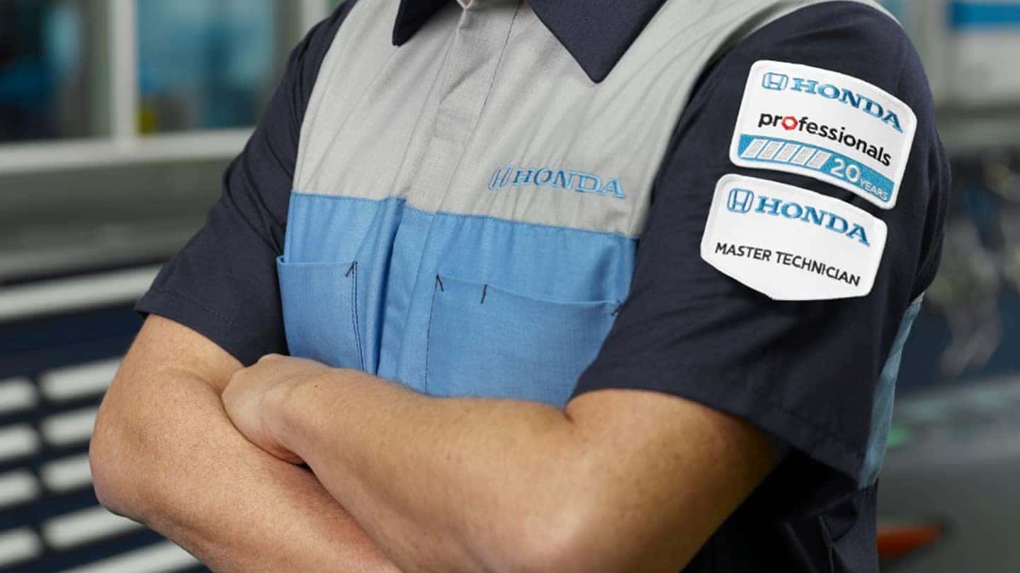 cropped shot of Honda service tech with arms folded