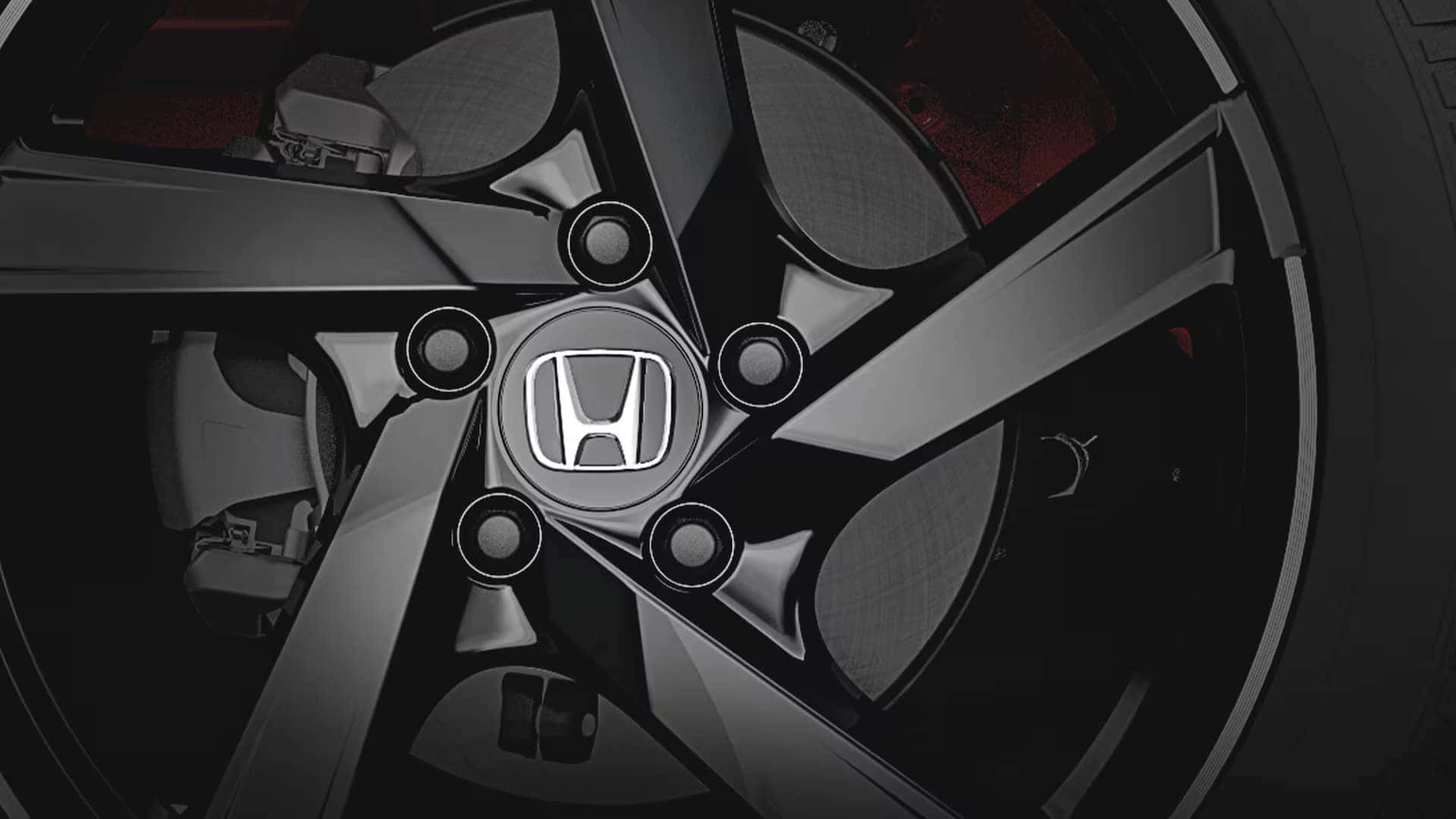 the black wheel of a honda civic sedan