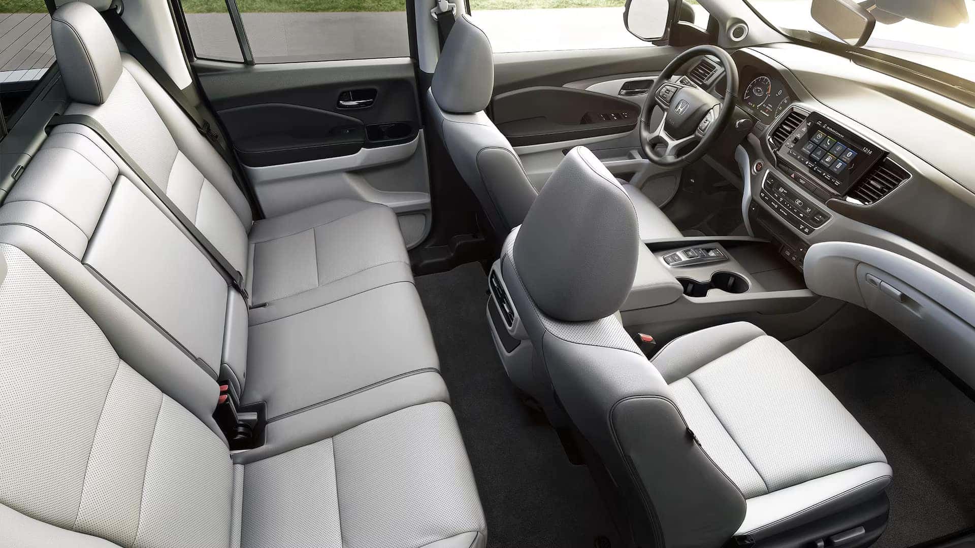 the interior display of the honda ridgeline showcasing the entire front and backseats