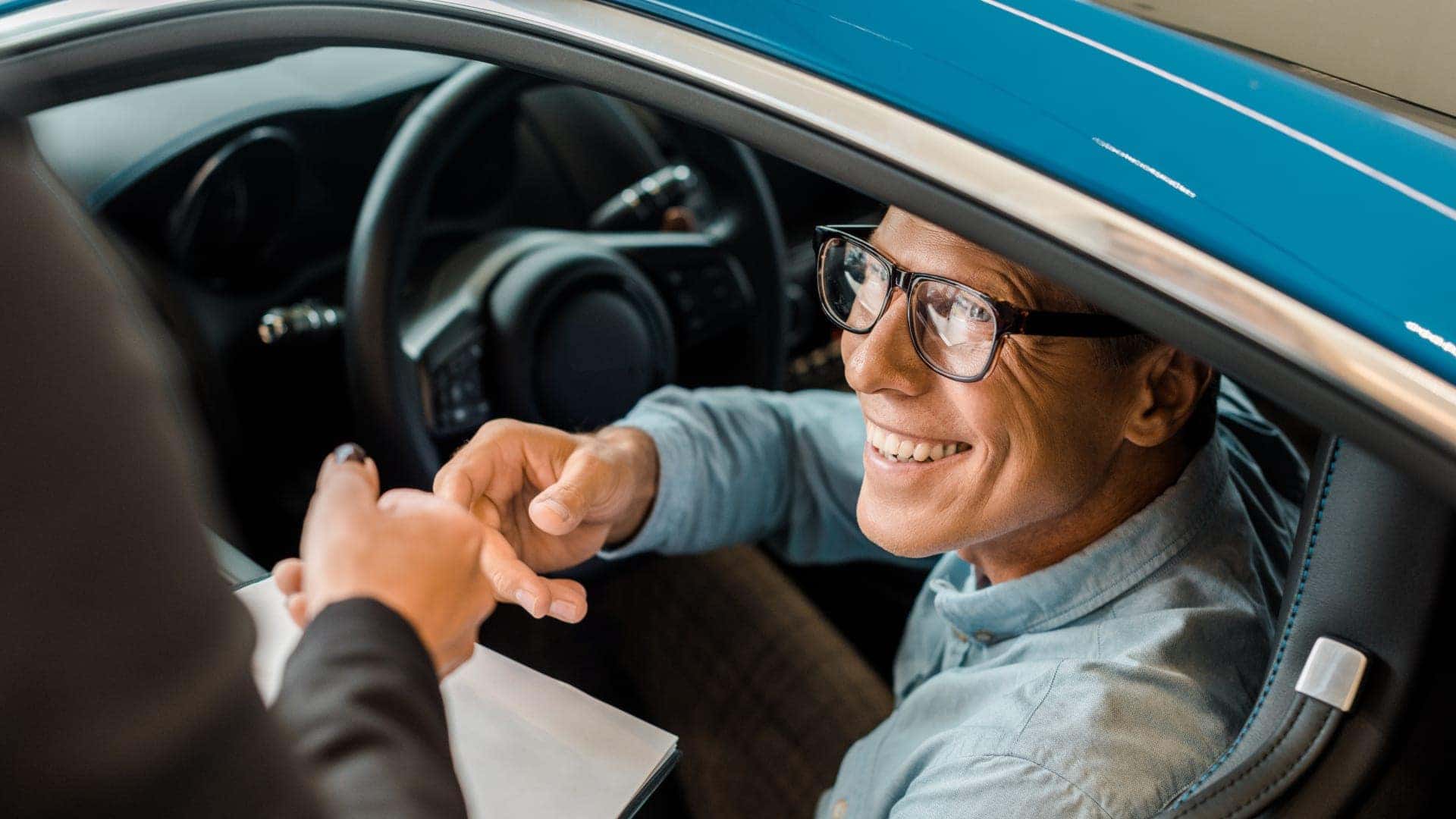 man in car